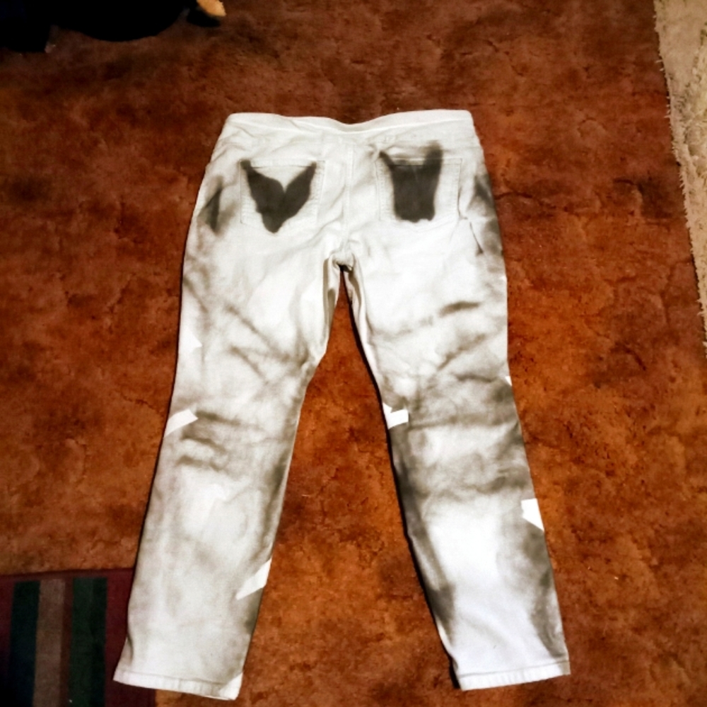 White funky pants with black and white designs.